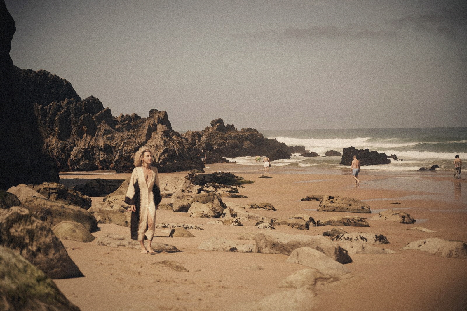 Karin walking on the rocky shore